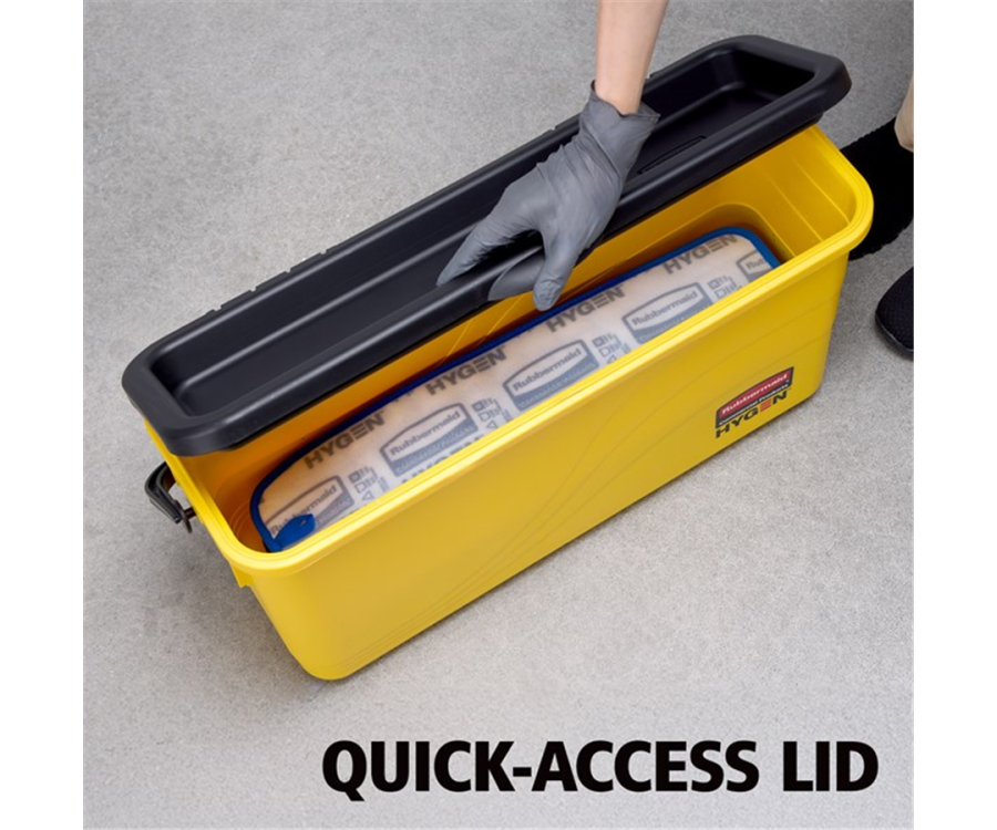 A yellow rectangular container with a black lid being opened by a gloved hand, revealing cleaning cloths inside. HYGEN™ Yellow Microfiber Charging Bucket (23.8 in. x 9.5 in. x 13.6 in., 3/Case)